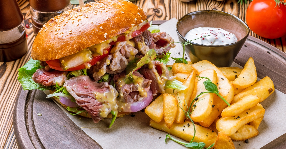 burger with pastrami and fries
