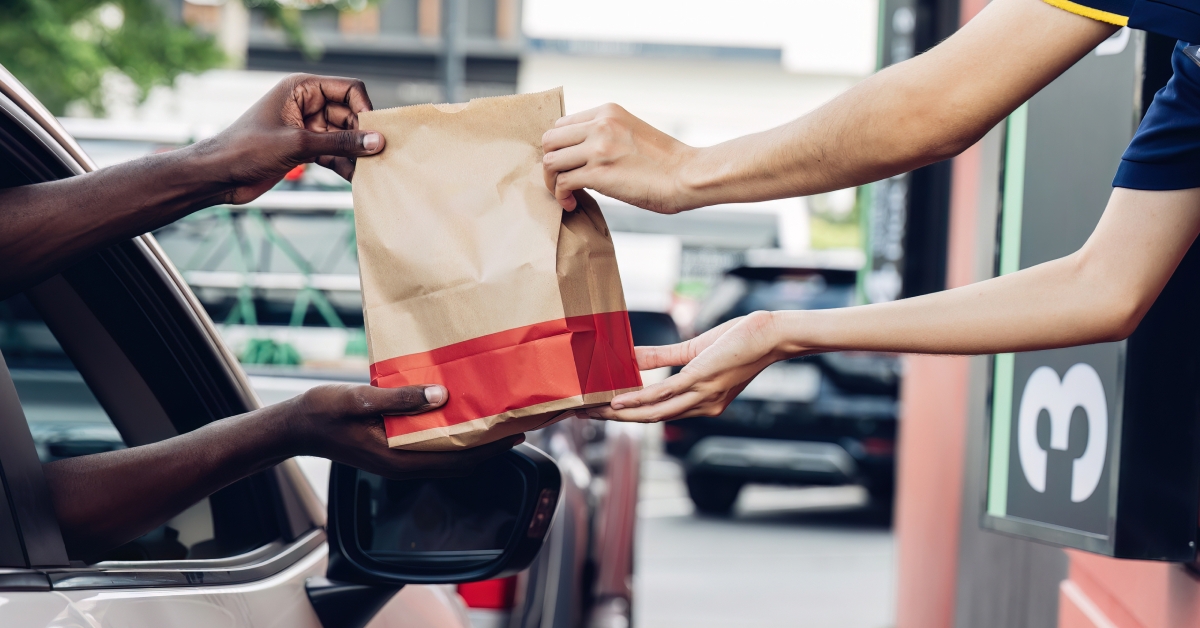 receiving coffee in drive thru