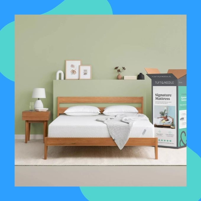 A mattress next to its packaging
