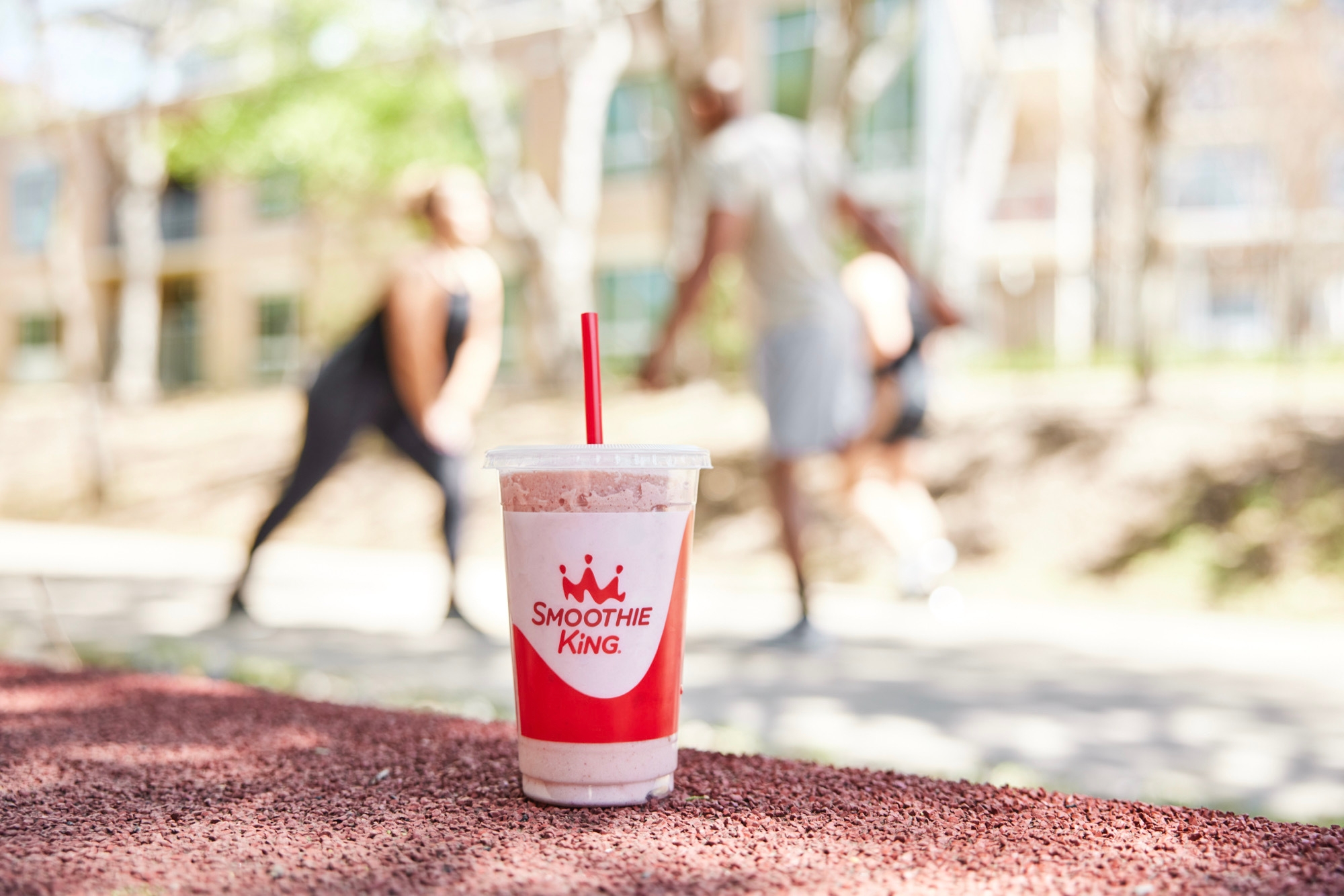 pink smoothie in smoothie king cup