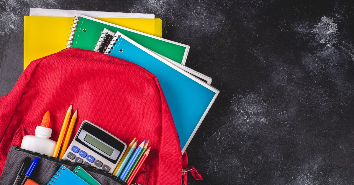 Backpack With School Supplies on countertop