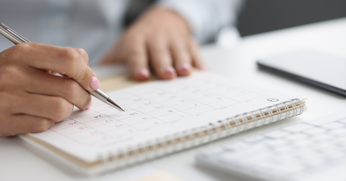 person marking with pen