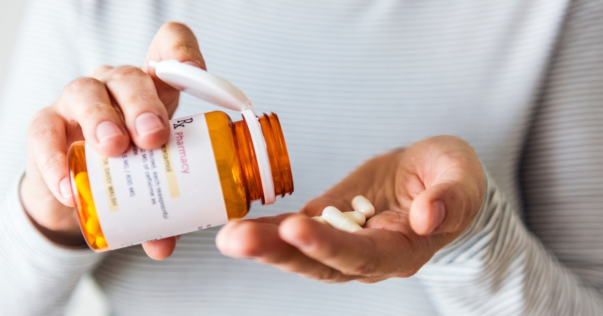 sick woman taking pills
