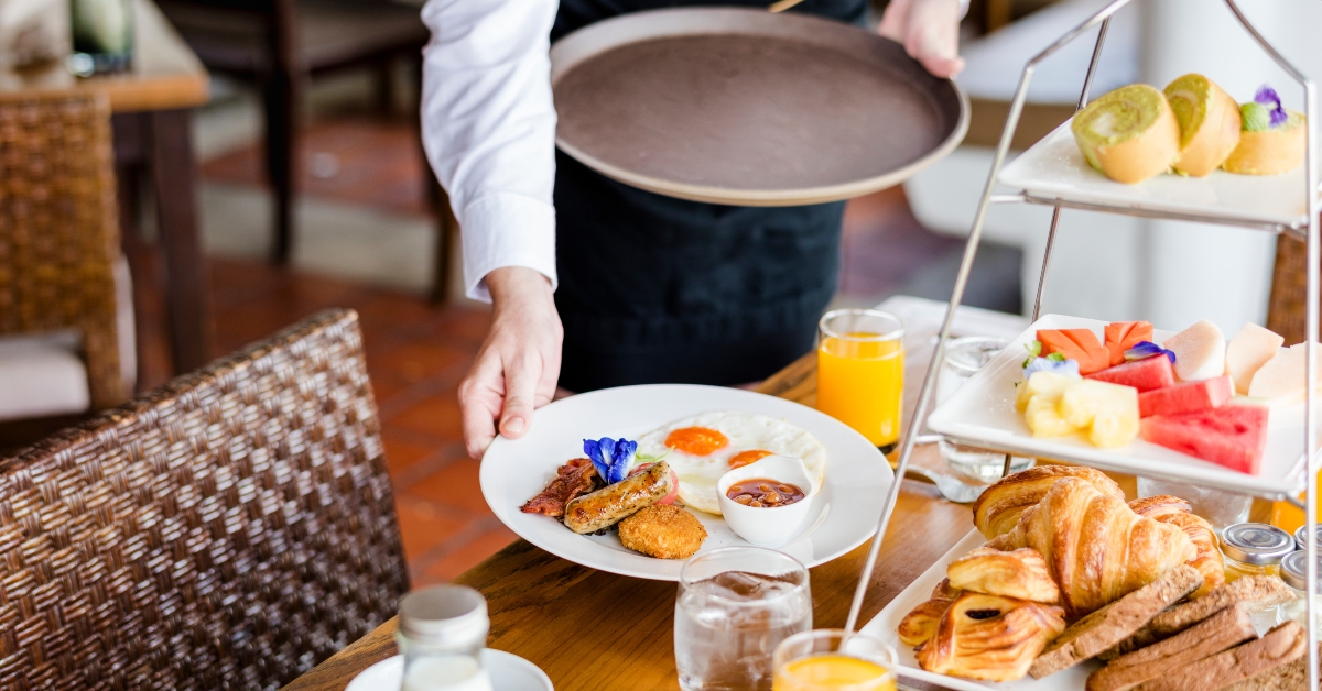 waitress serving breakfast
