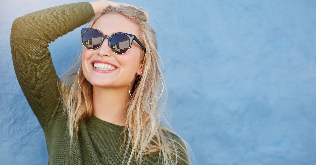 woman in sunglasses smiling