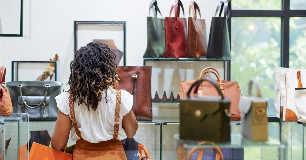 woman shopping at leather bags shop