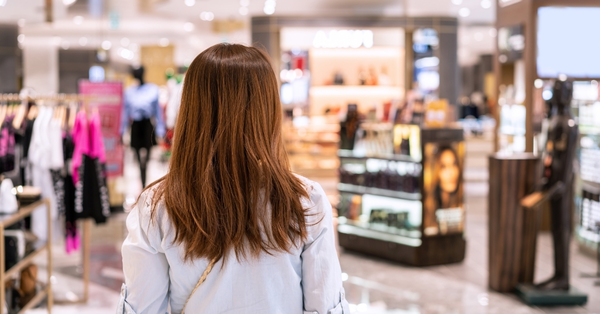 woman walking in clothes store