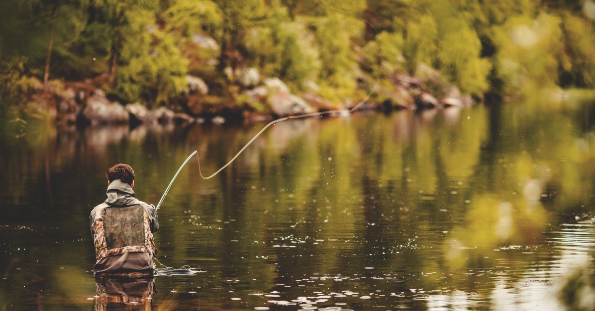 fisherman using rod fly