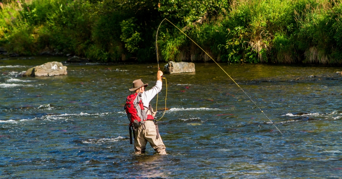 man fly fishing 