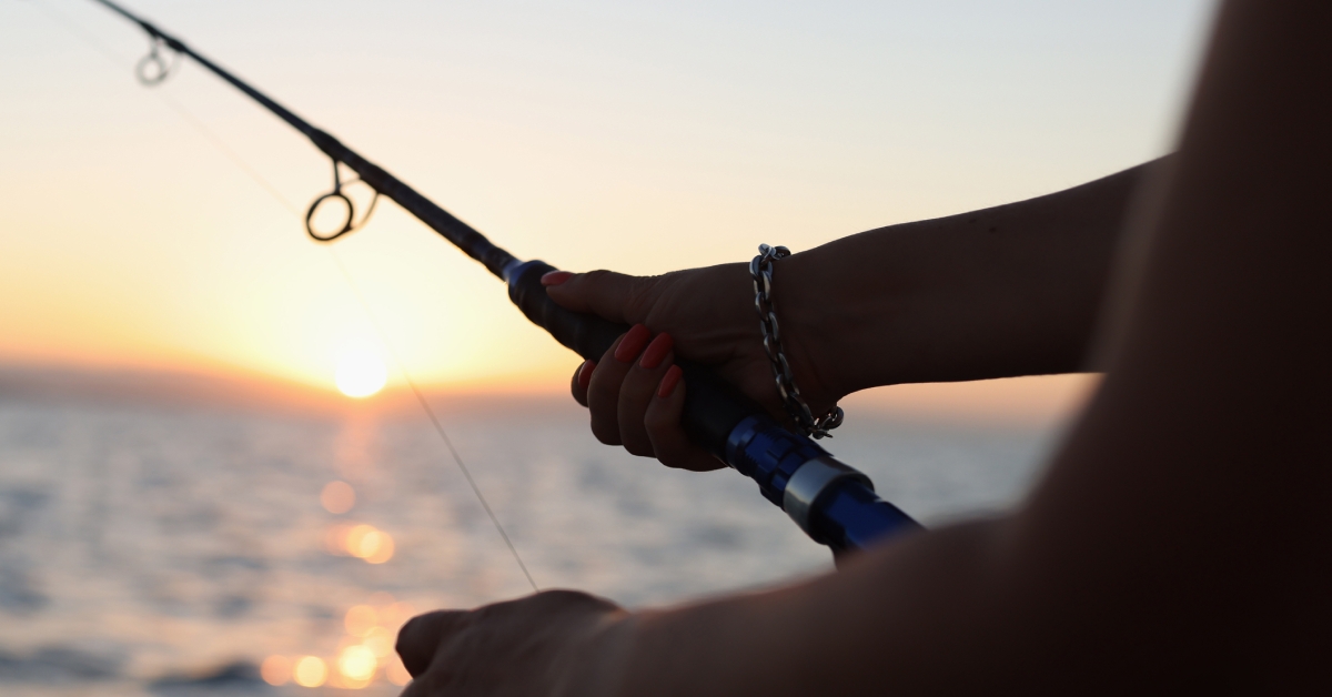 woman holding fishing rod 