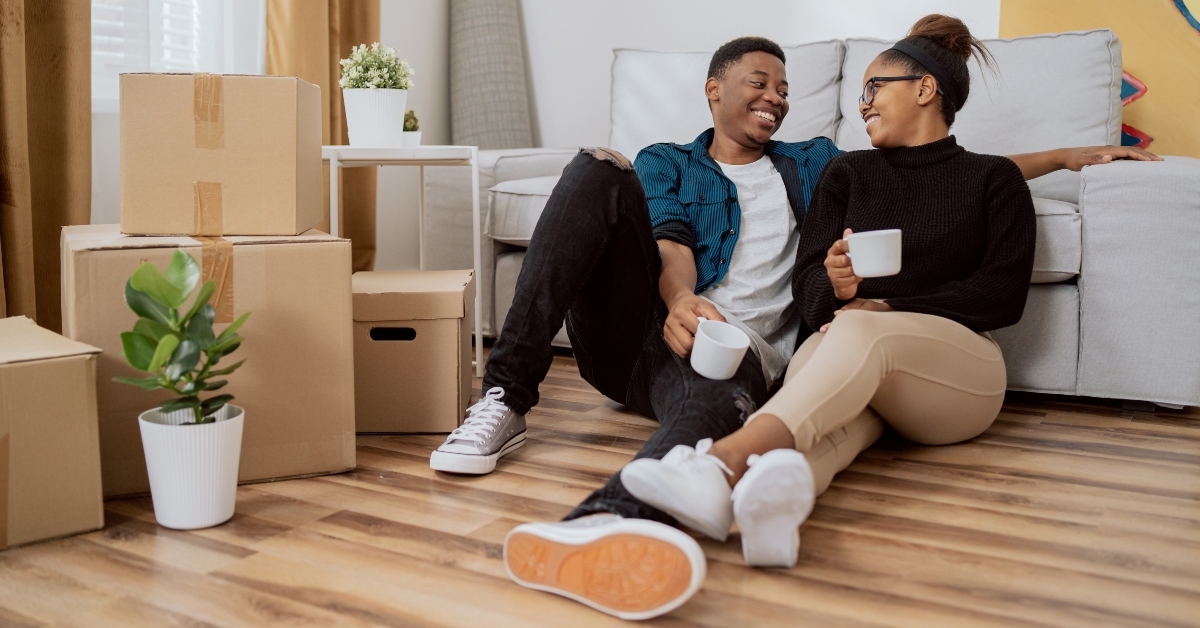 drinking coffee in their new apartment