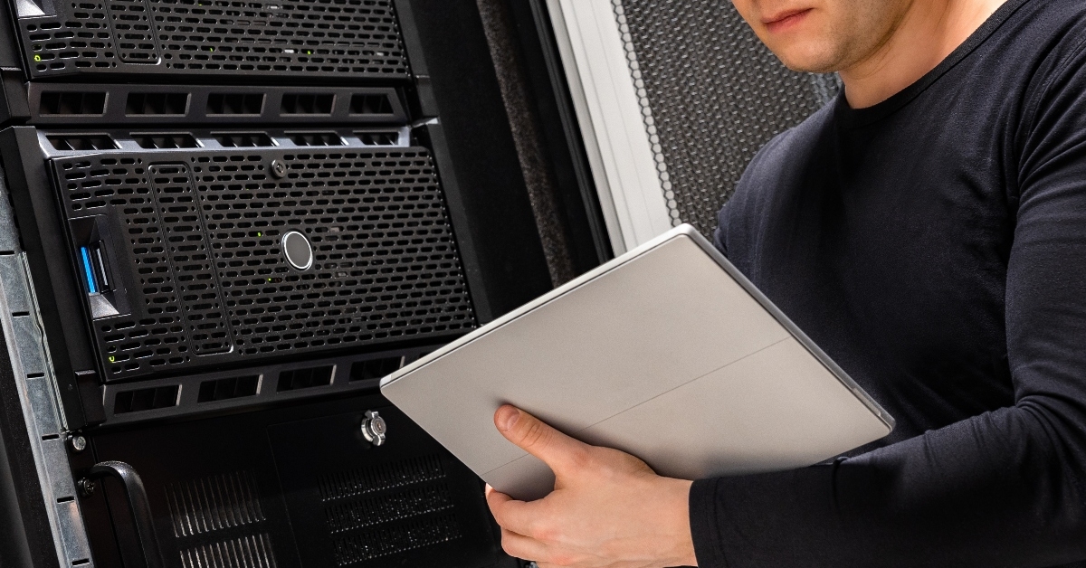 it consultant holding digital tablet