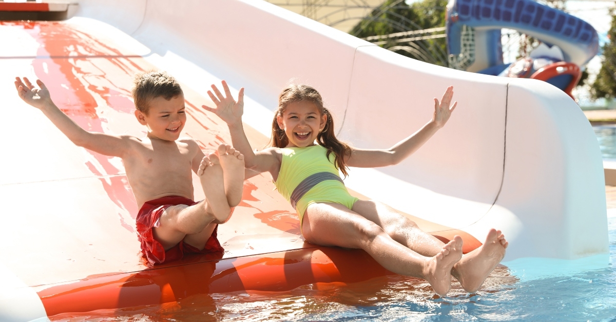 children on slide at water park