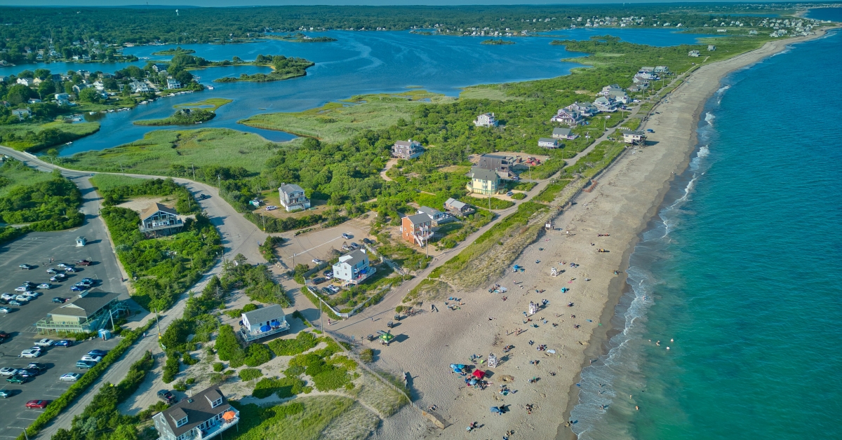 sandy beach with people relaxing
