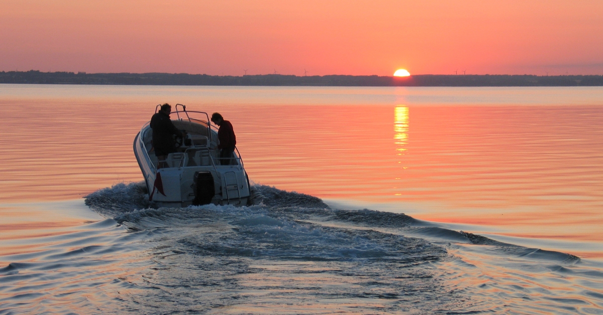 speedboat sails into the sunset