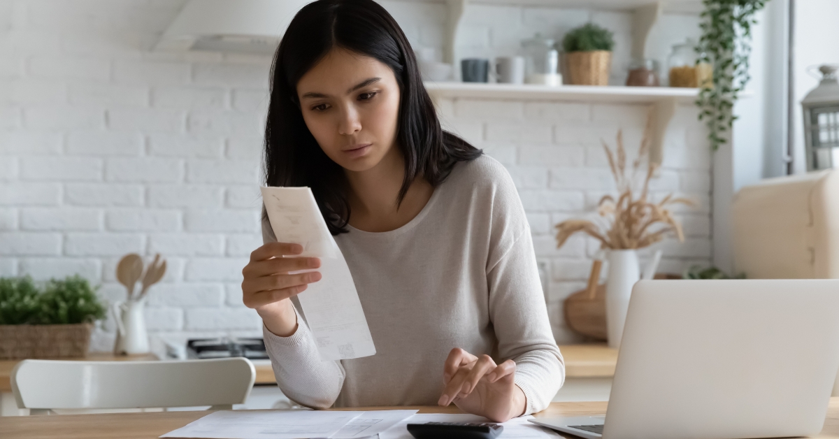 asian woman calculating utility bill