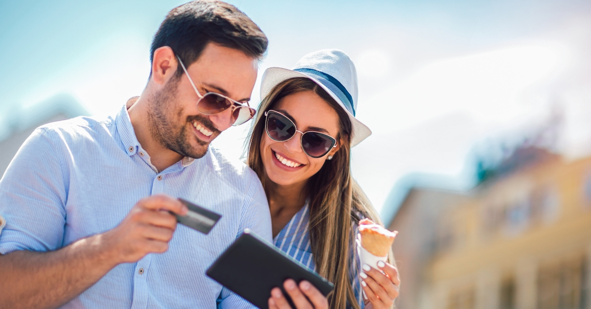 happy couple paying online
