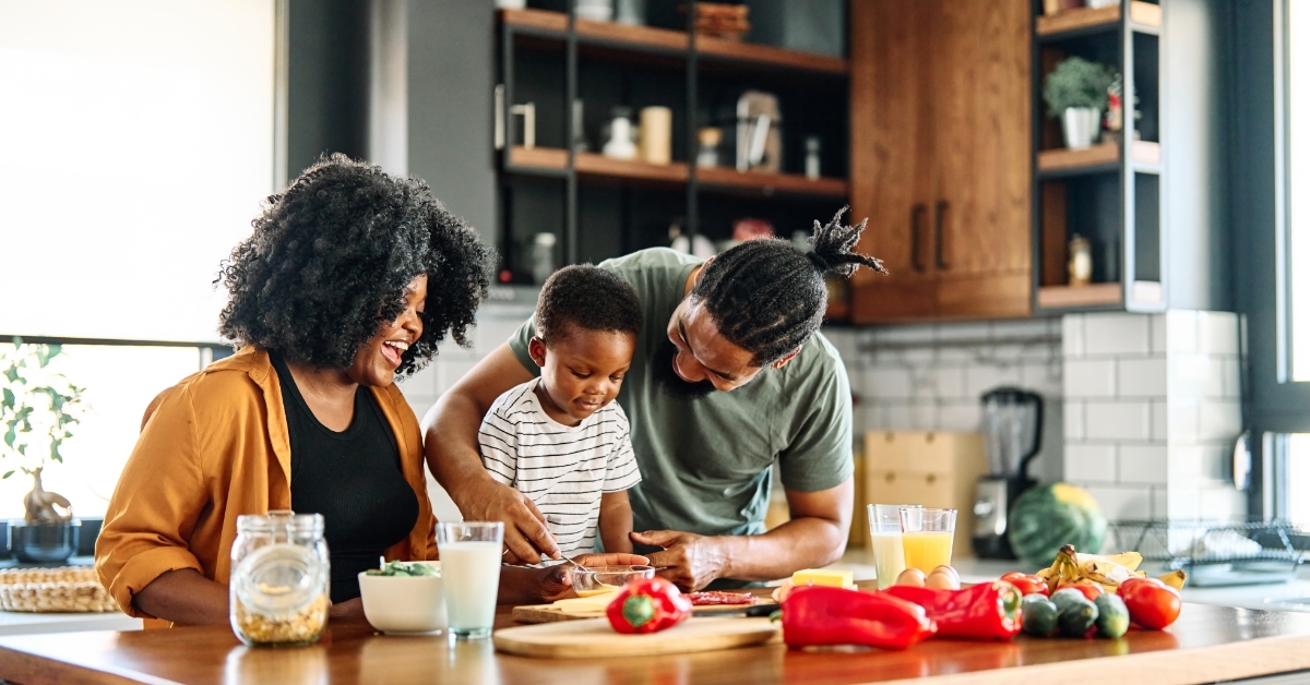 african american family prepring breakfast together
