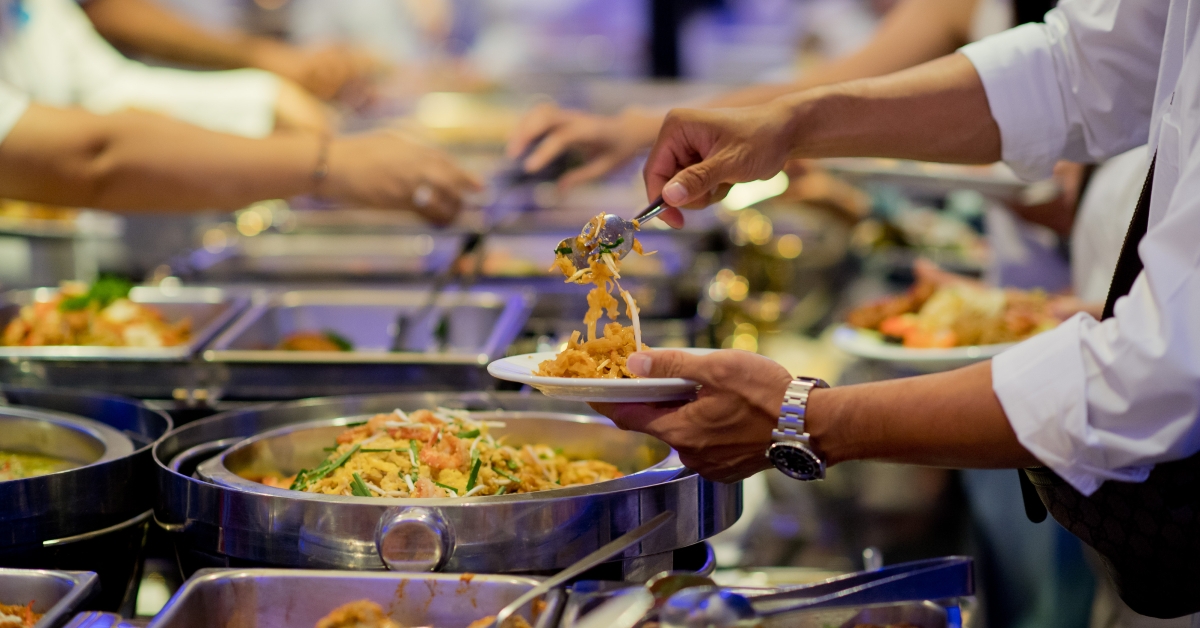 man scooping the food