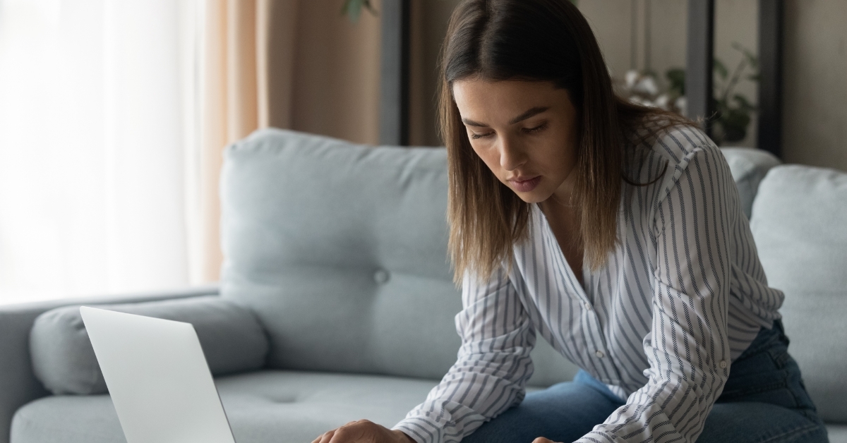 focused female student calculating student loan