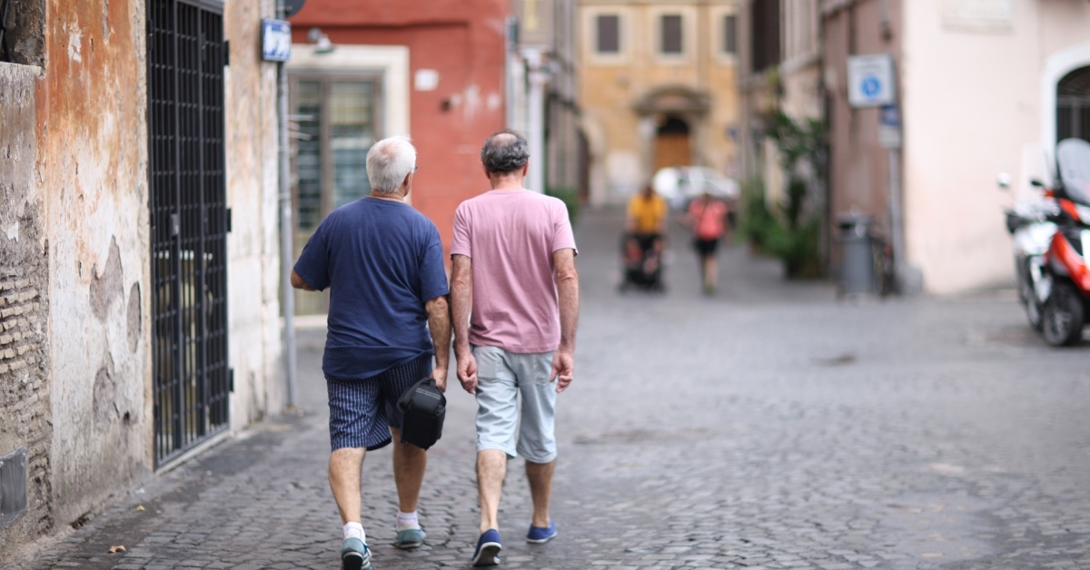 male tourists walking on street