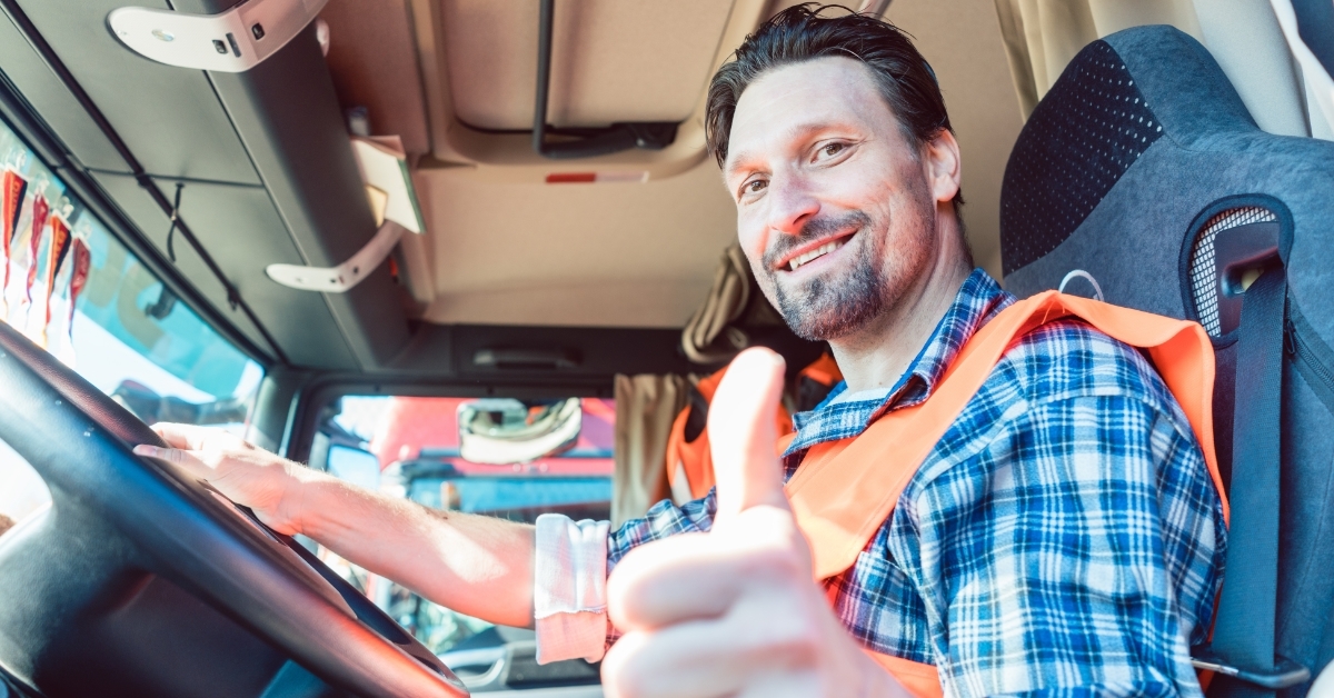 male truck driver giving thumbs up
