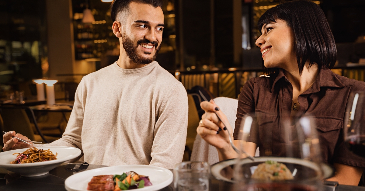 happy couple dining at restaurant