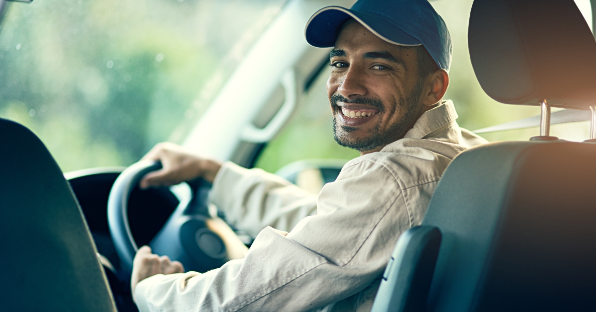 happy courier driving