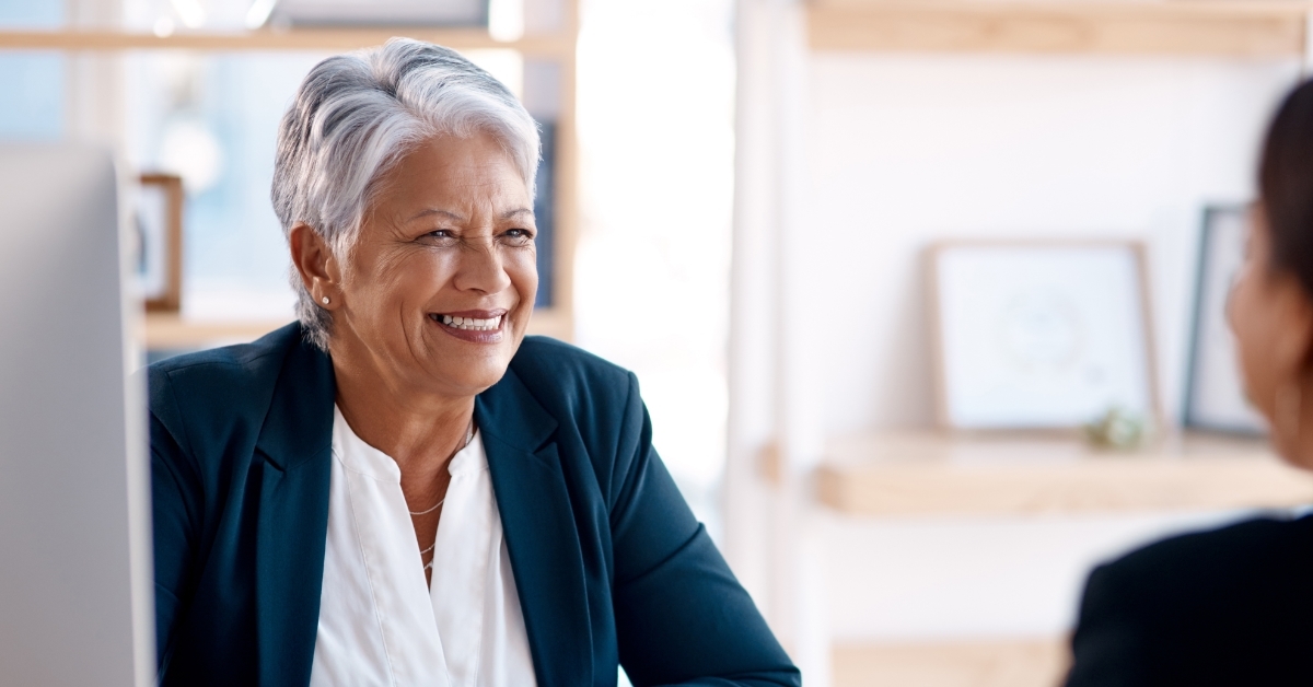 senior business woman talking to employee