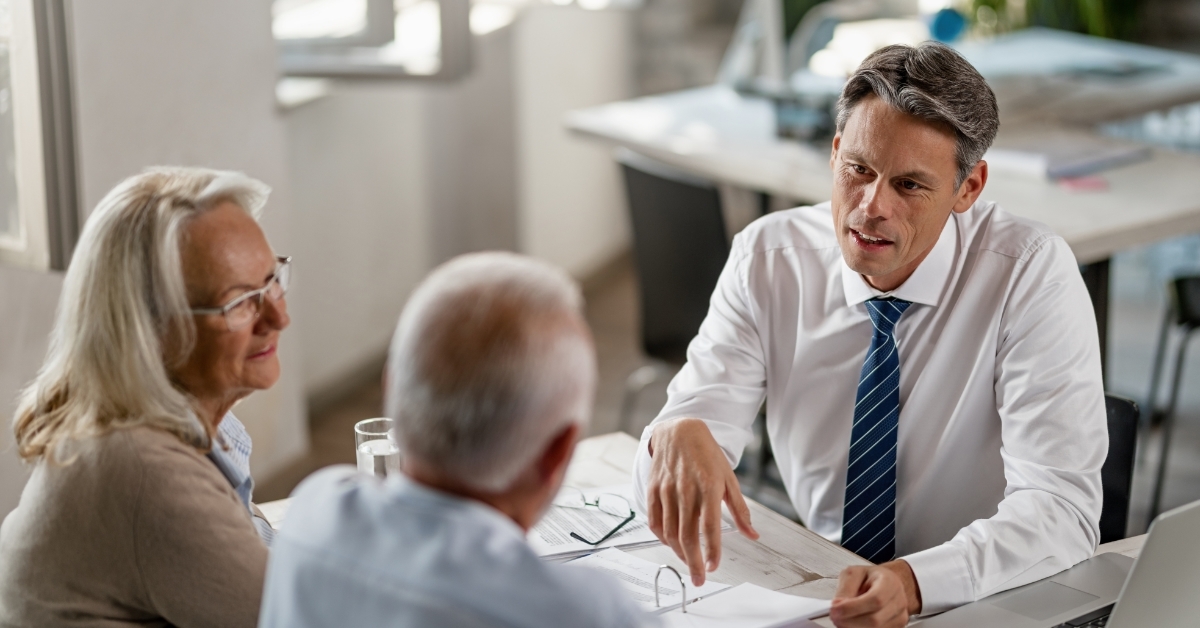 senior couple consulting insurance agent