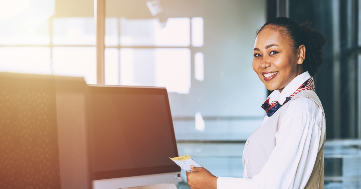 smiling ground hostess at airport reception