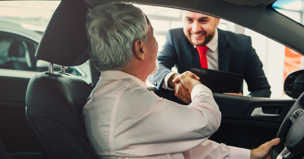 man buys car from dealer