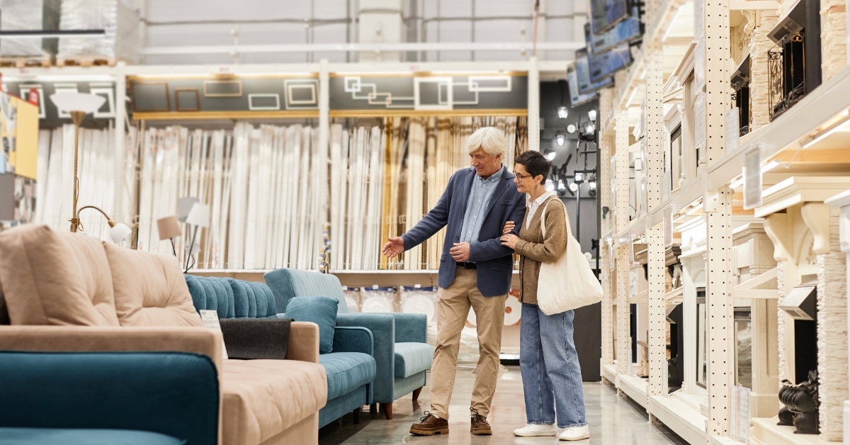 senior couple checking furniture at store