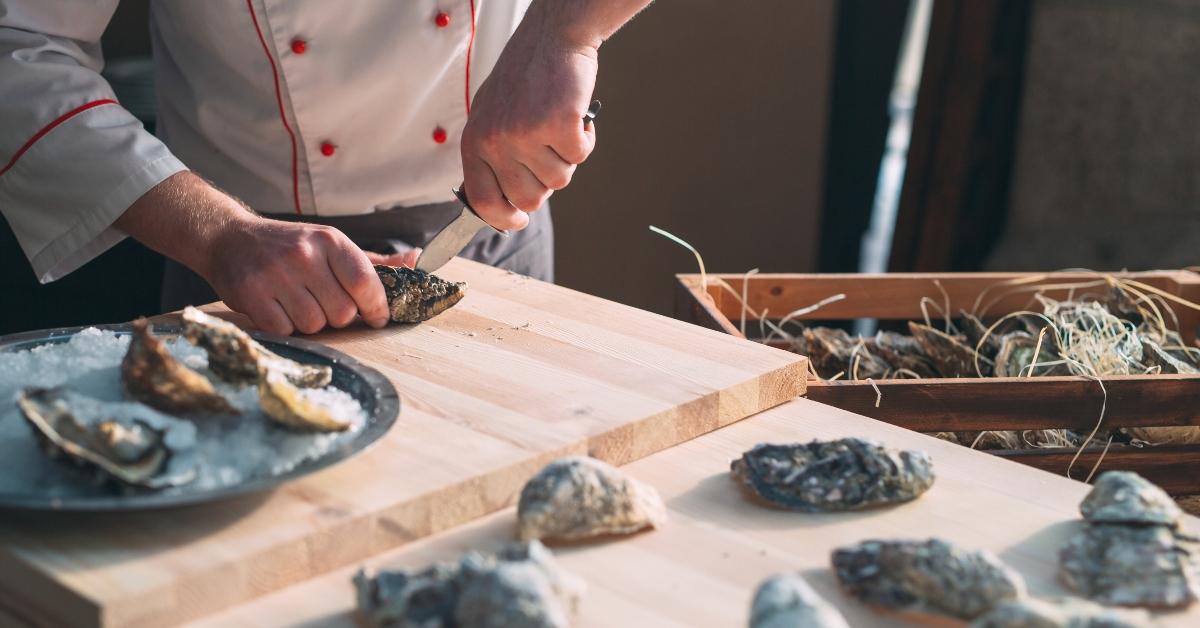 chef opens oysters