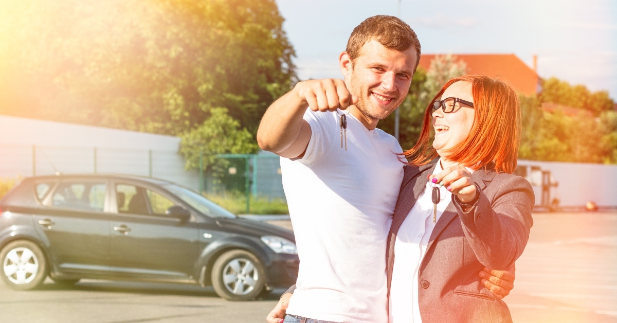 couple holding car keys