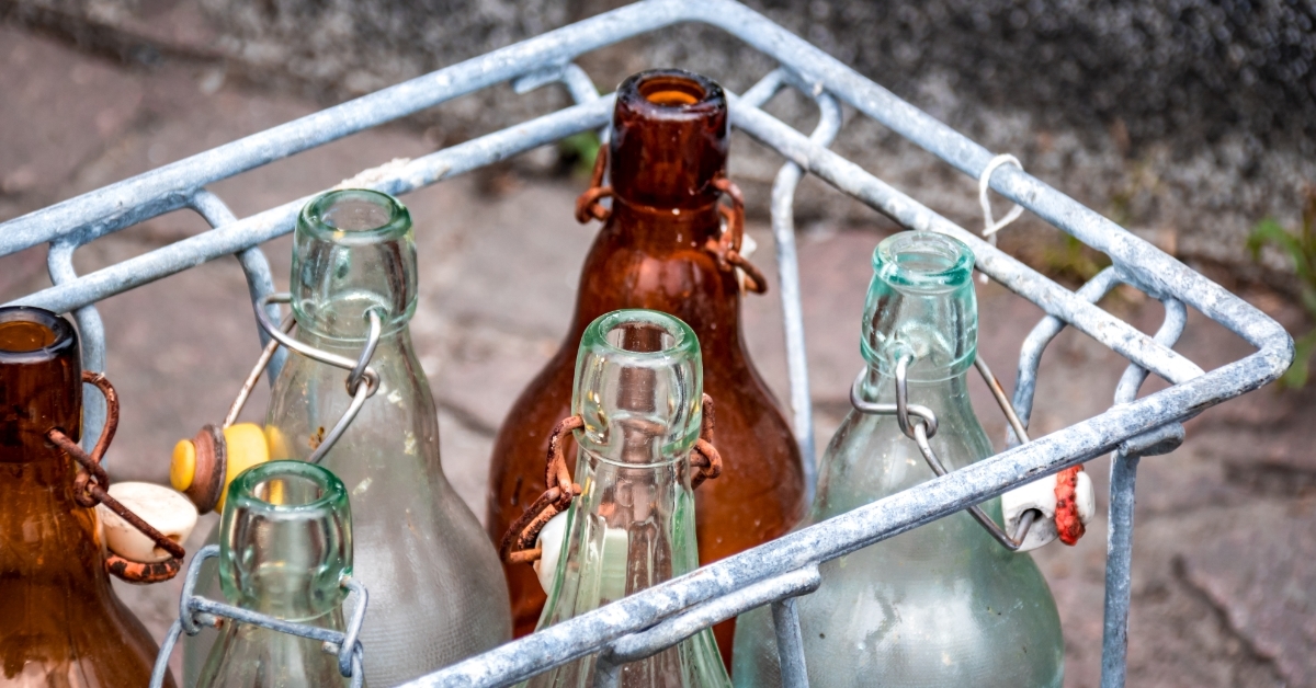 glass bottles in metal basket