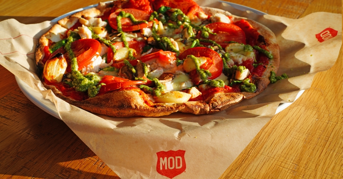 MOD vegetarian Pizza on wooden table