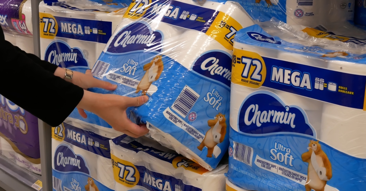 Woman picking bathroom tissue