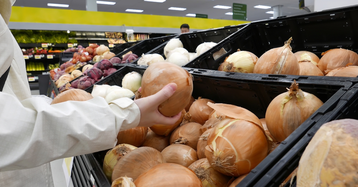 Woman picking fresh onion
