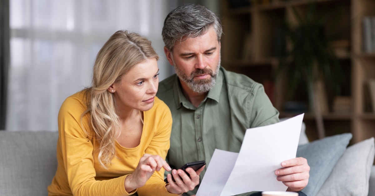 mature couple planning budget together