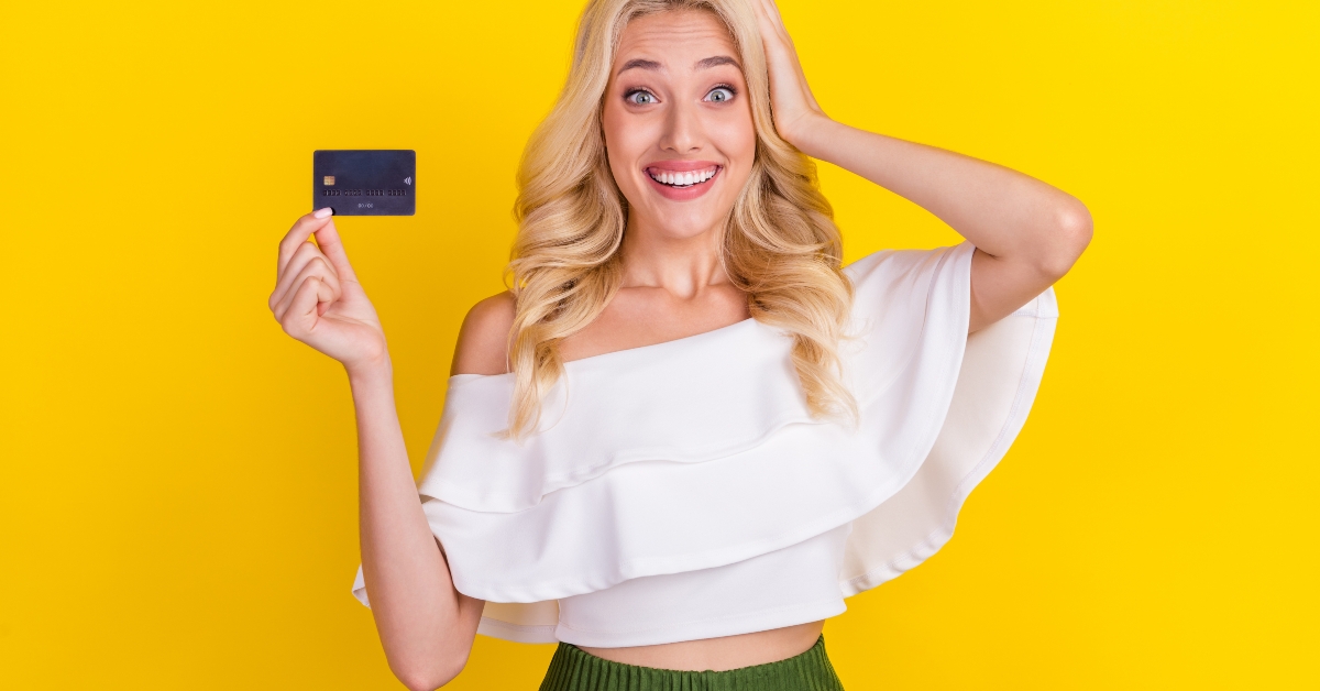 Girl holding hand bank card