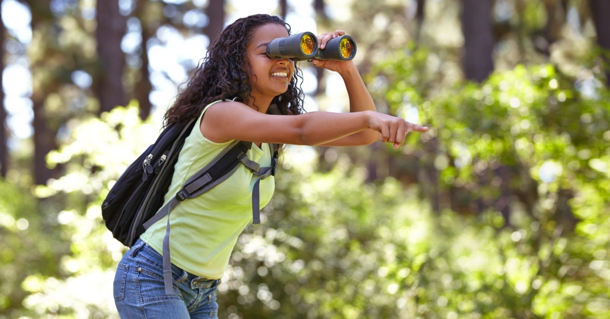happy girl with binoculars