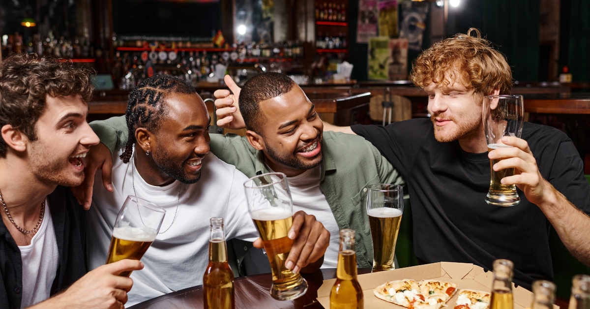 friends chatting and holding glasses