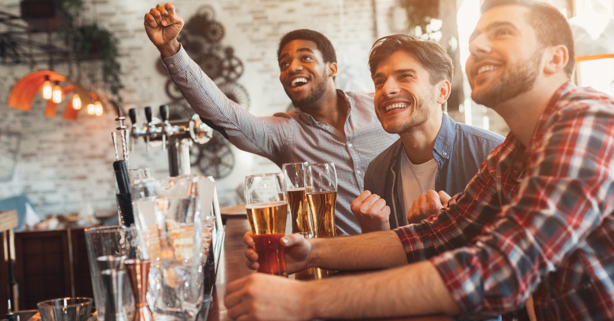 Friends watching football in bar