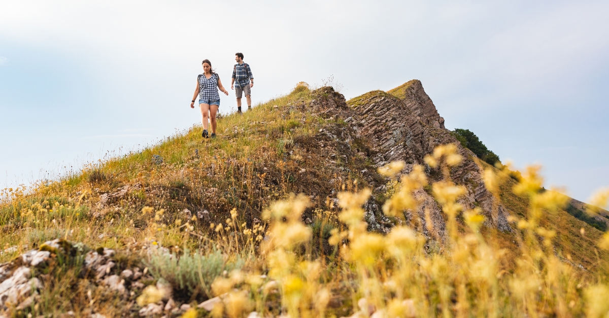 couple walking and hiking at mountains