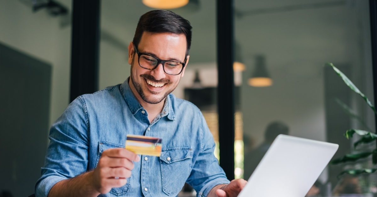 freelancer man using card for shopping online