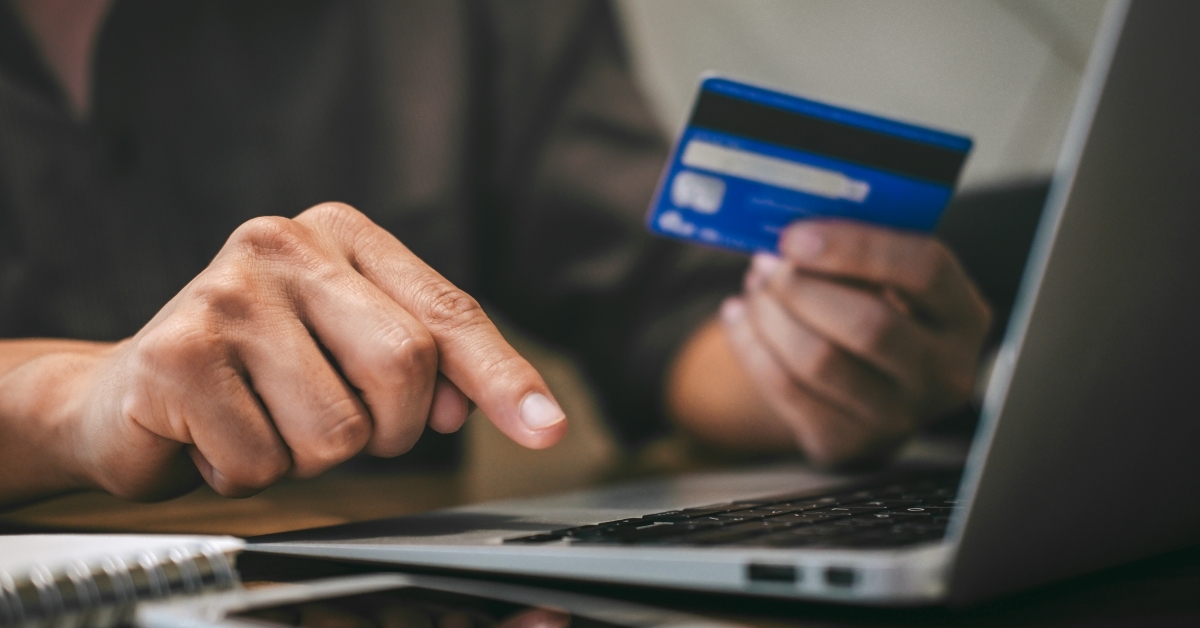 man using card for online shopping
