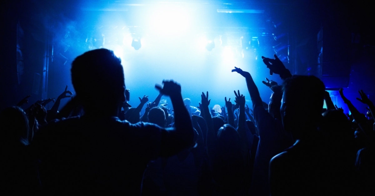 crowd of people watching a band 