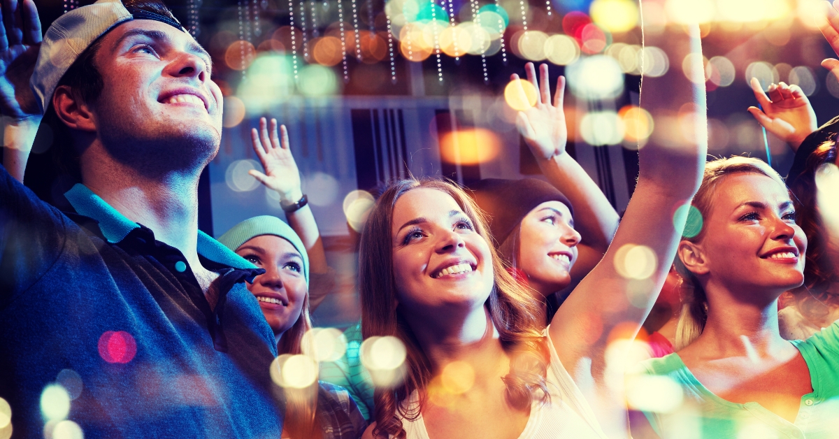 happy friends at concert