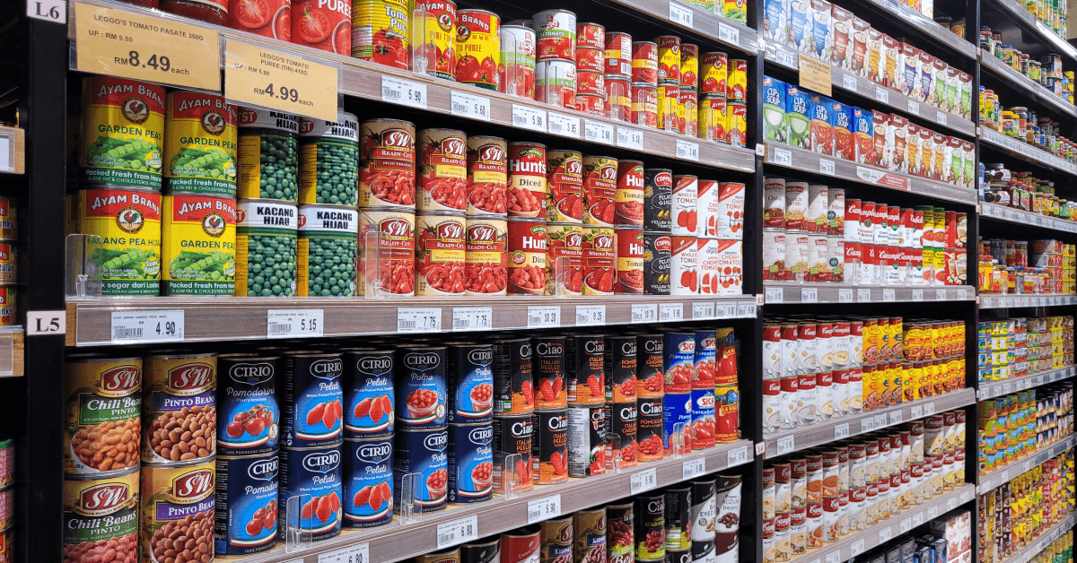 Shelf of canned food in grocery store